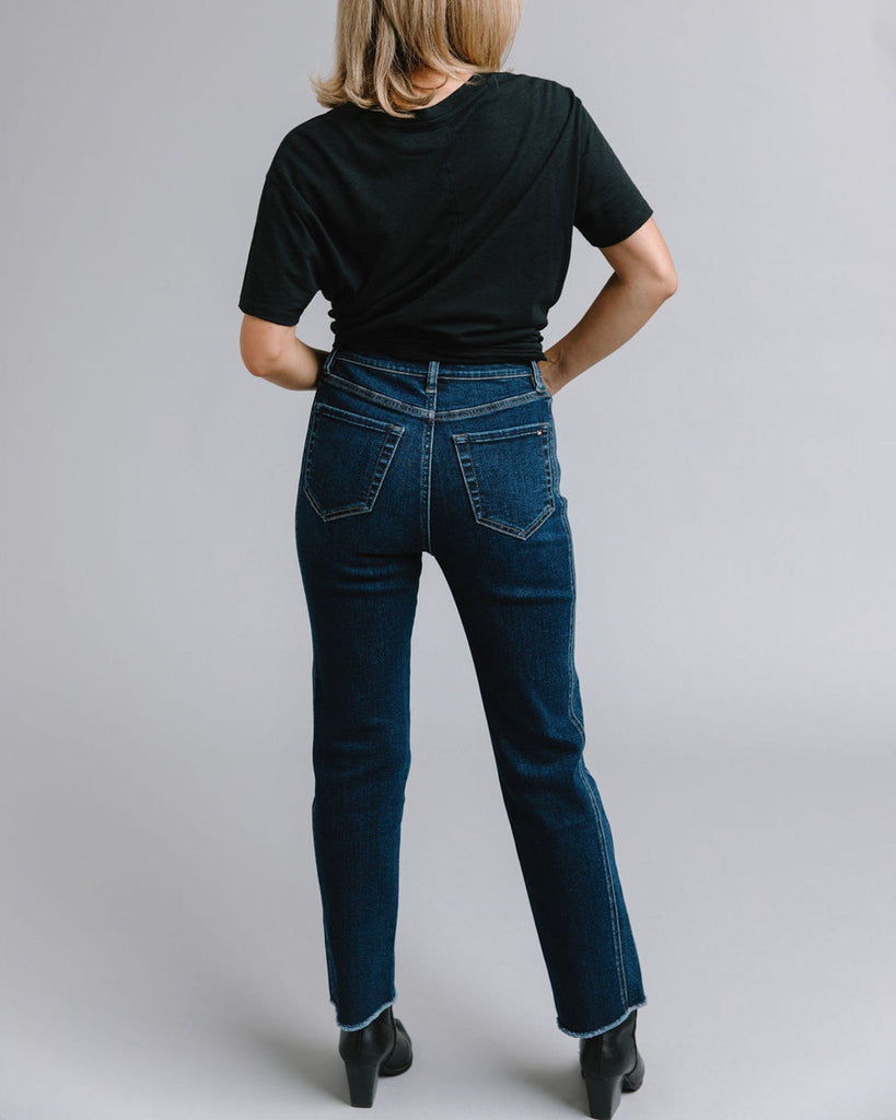 Woman in mid-rise blue jeans