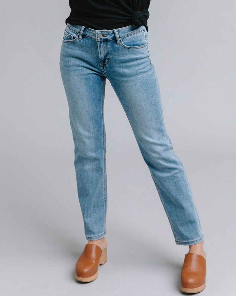 Woman in blue mid-rise straight jeans