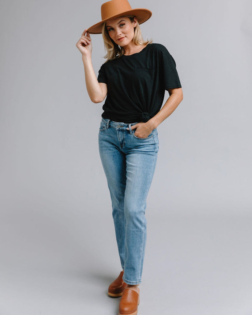 Woman in blue mid-rise straight jeans