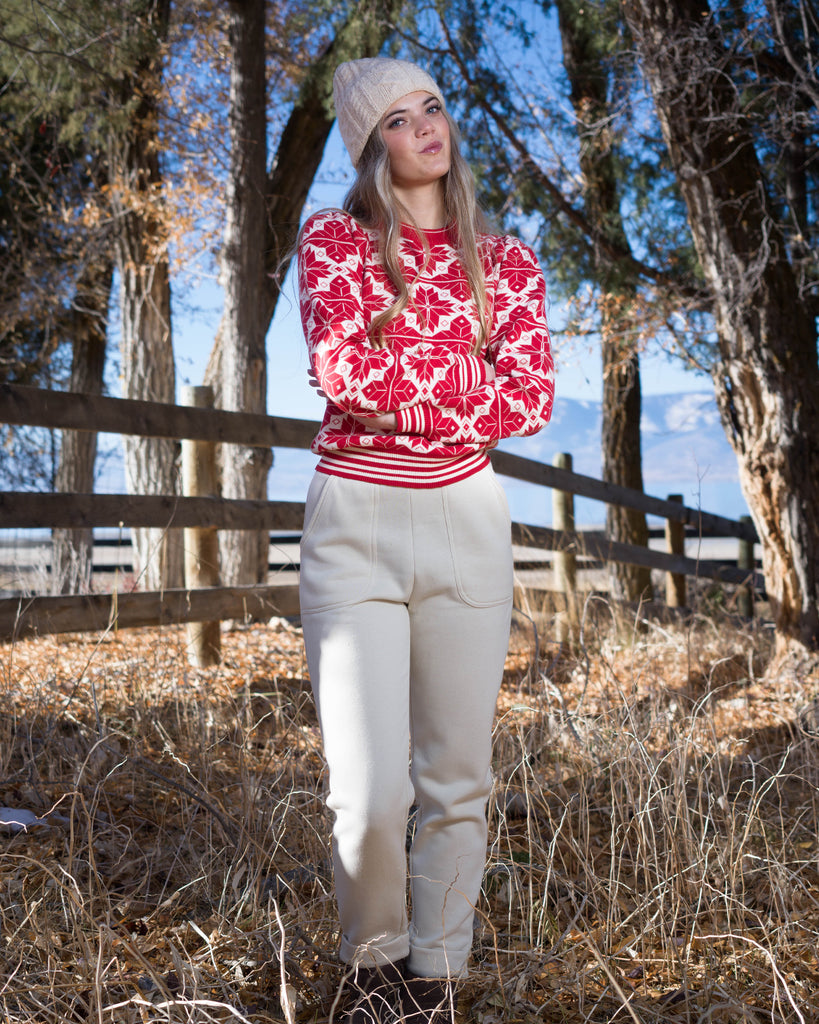 Woman in a red and white snowflake design sweater