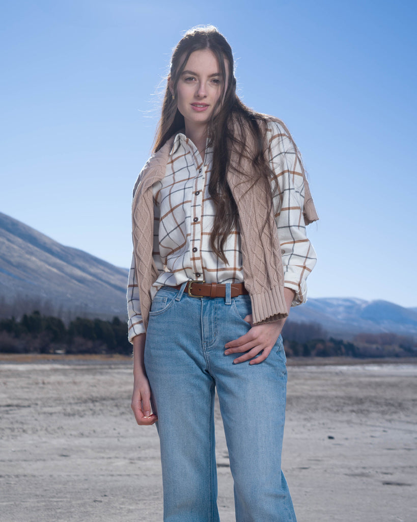 Woman in a beige plaid buttondown