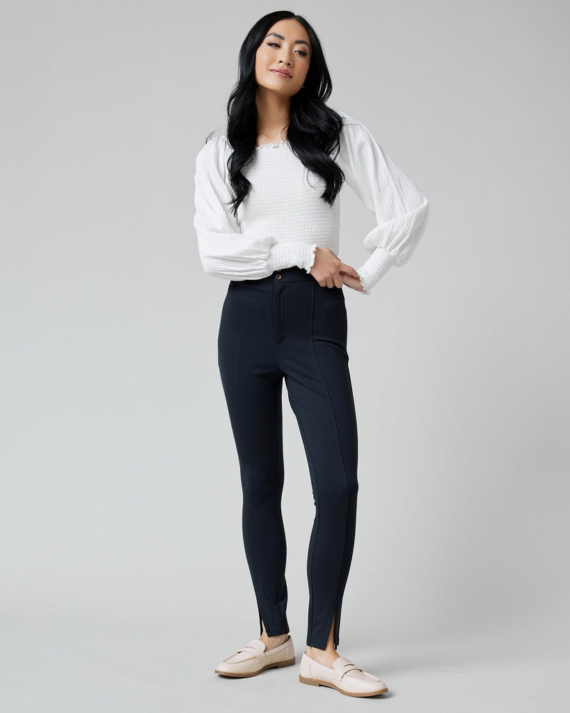 Woman in black fitted pants