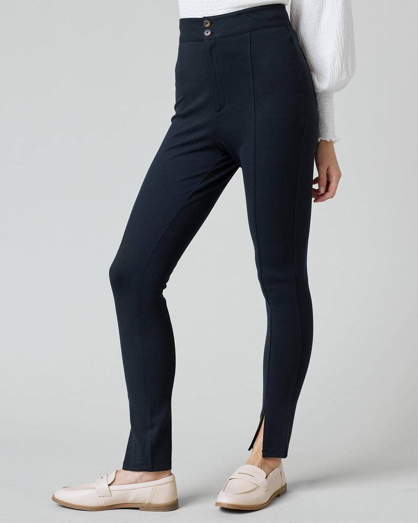 Woman in black fitted pants