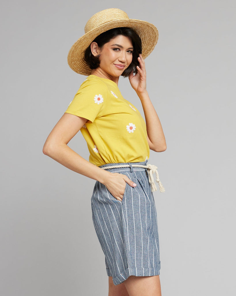 Woman in blue and white vertical striped shorts