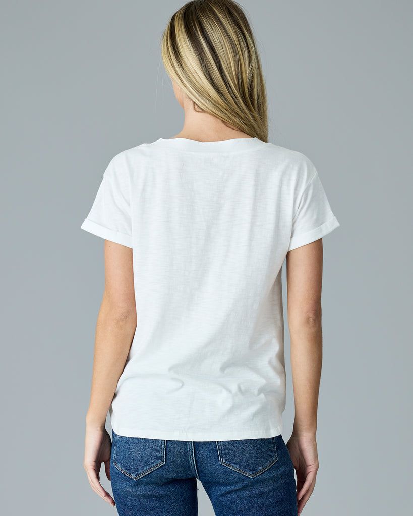 Woman in a white, short sleeve v-neck tee