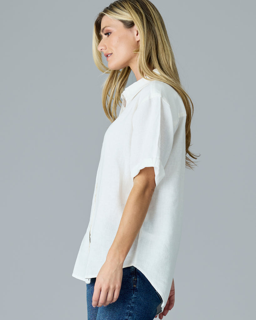 Woman in a white short sleeve button-down