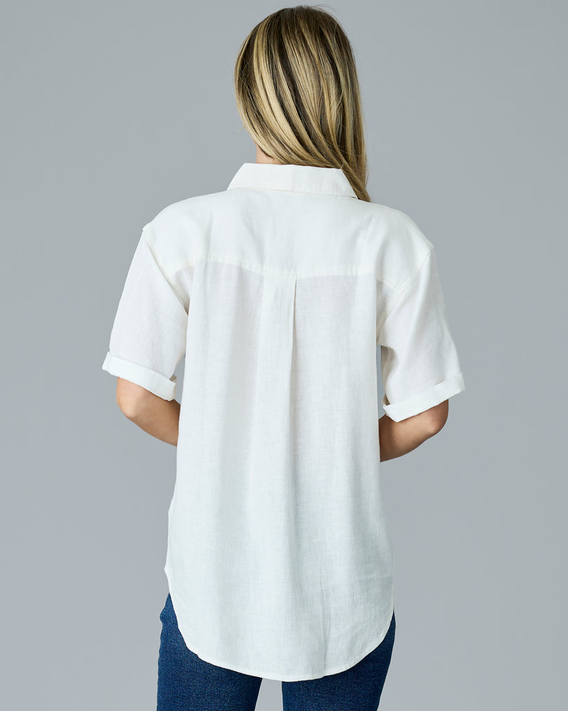 Woman in a white short sleeve button-down