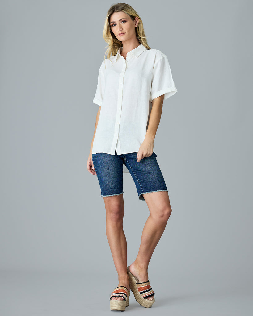 Woman in a white short sleeve button-down