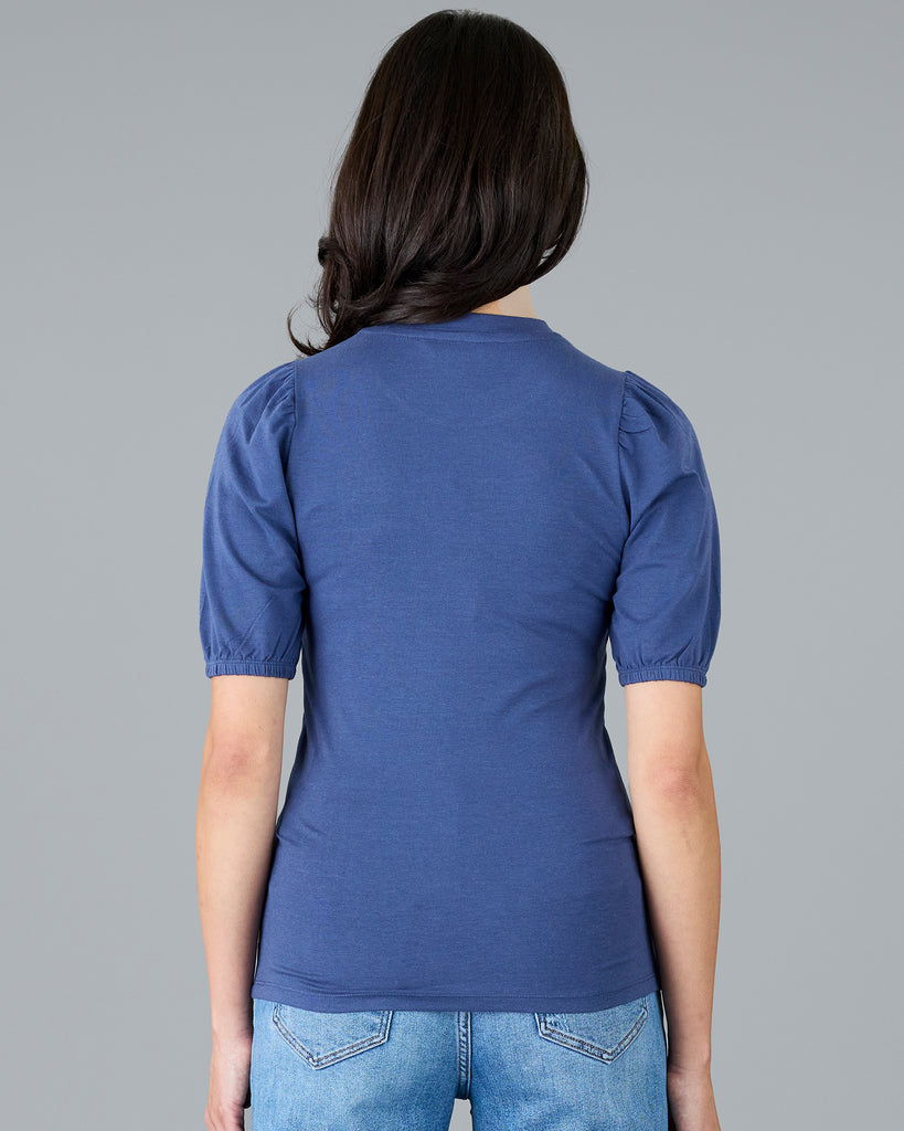 Woman in blue short sleeved tee