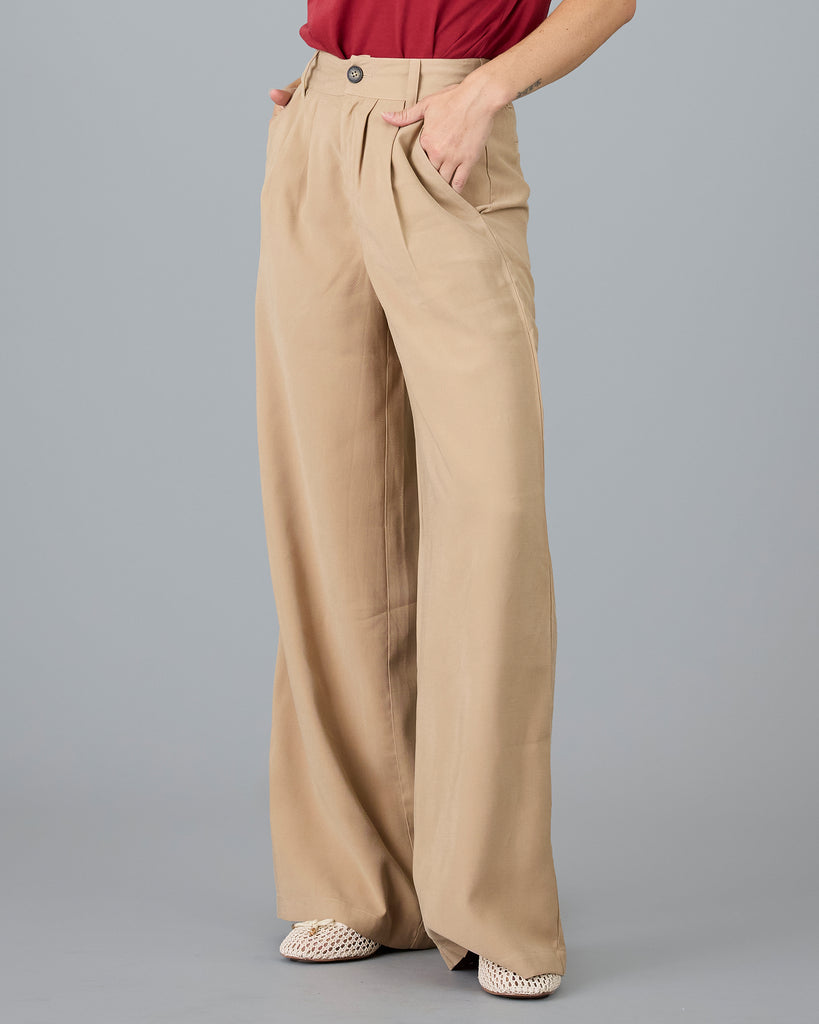 Woman in beige trousers