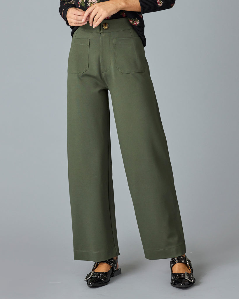 Woman in a pair of green, cropped trousers