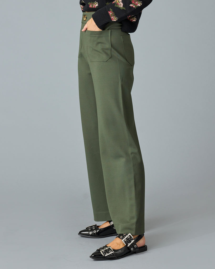 Woman in a pair of green, cropped trousers