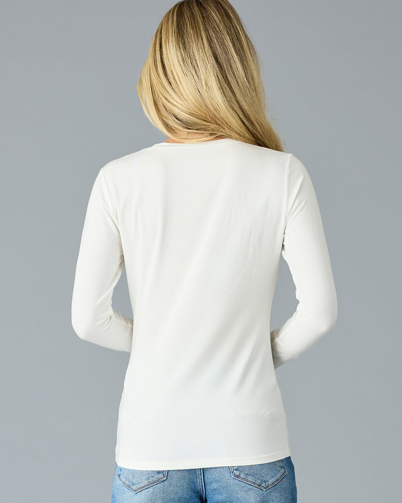 Woman in a white long sleeve basic tee