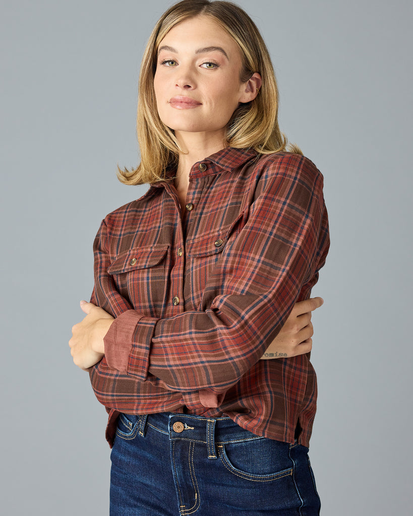 Woman in a red and brown plaid buttondown top