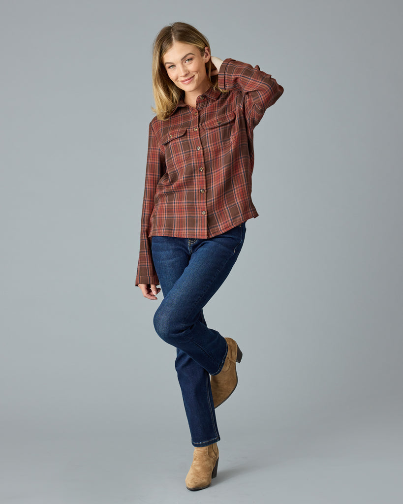 Woman in a red and brown plaid buttondown top