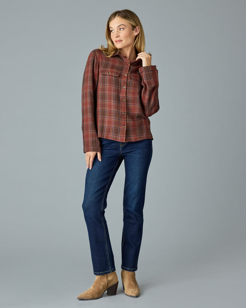 Woman in a red and brown plaid buttondown top