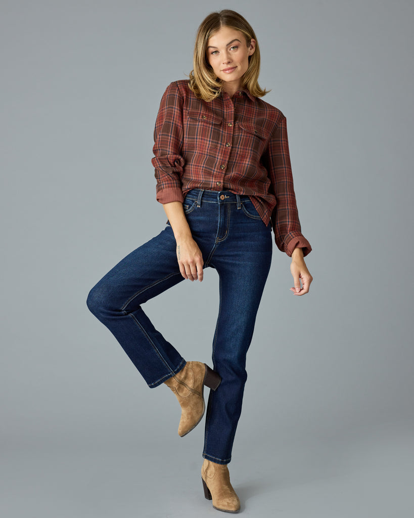 Woman in a red and brown plaid buttondown top