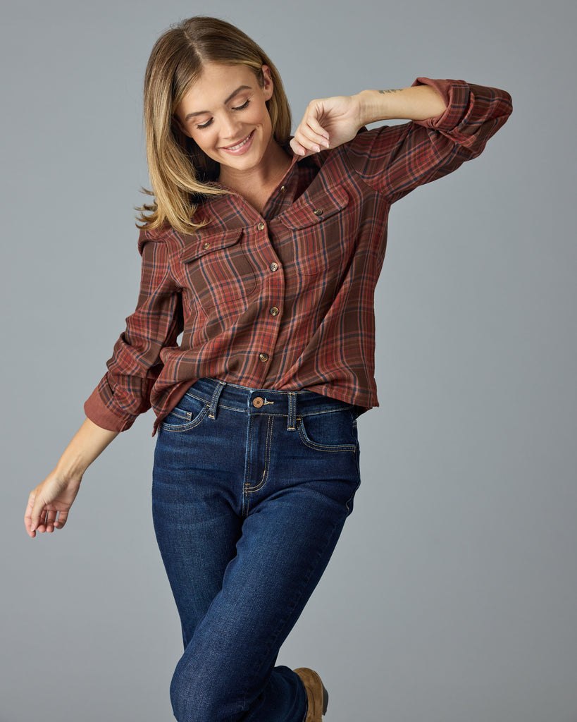 Woman in a red and brown plaid buttondown top