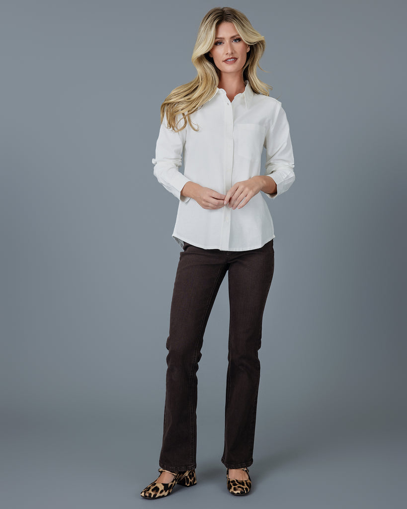 Woman in a white long sleeve buttondown 