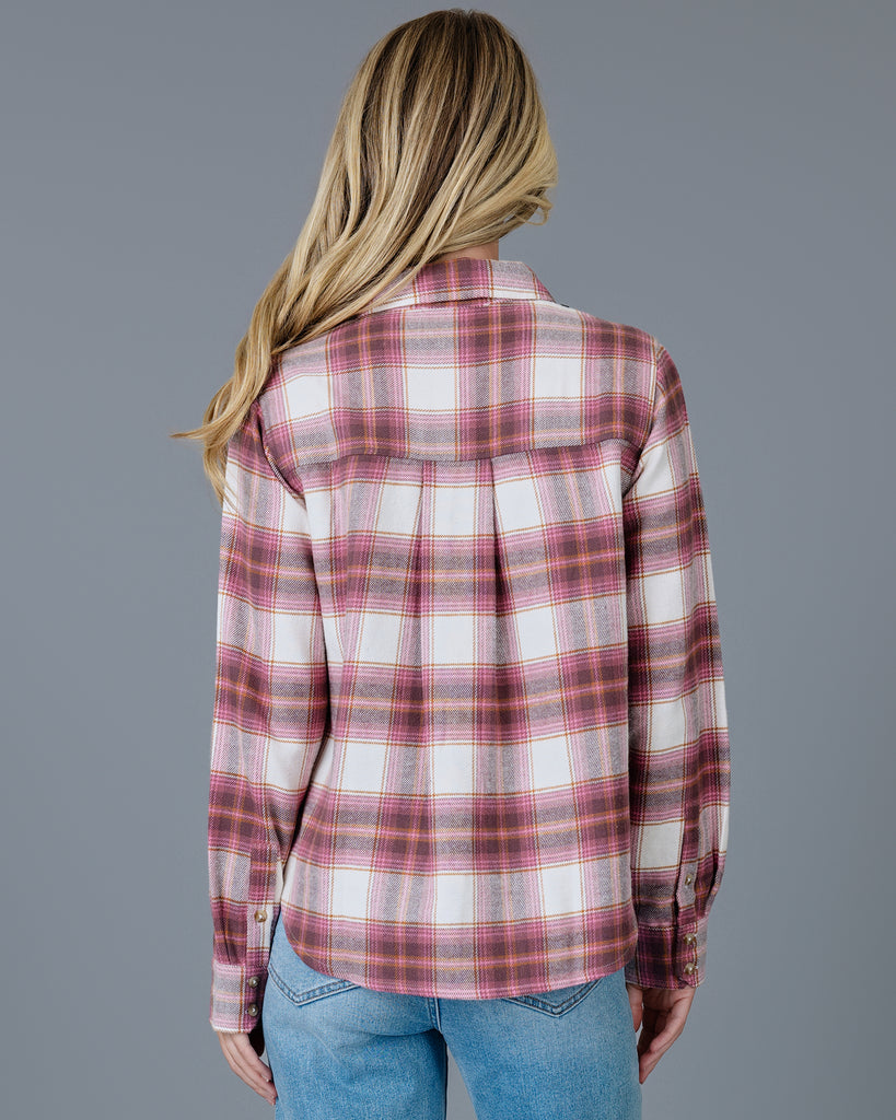 Woman in a pink plaid buttondown top