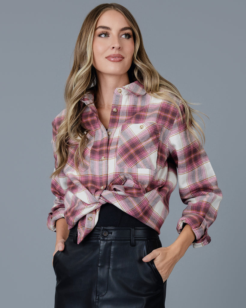 Woman in a pink plaid buttondown top