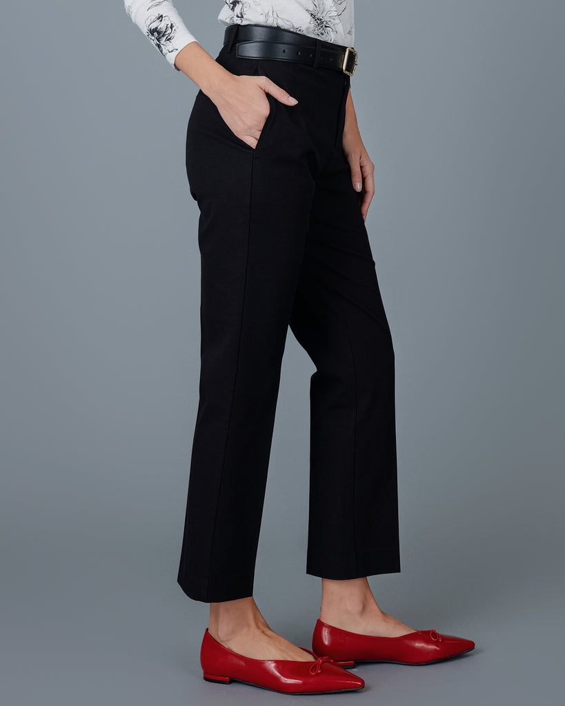 Woman wearing black tapered trousers