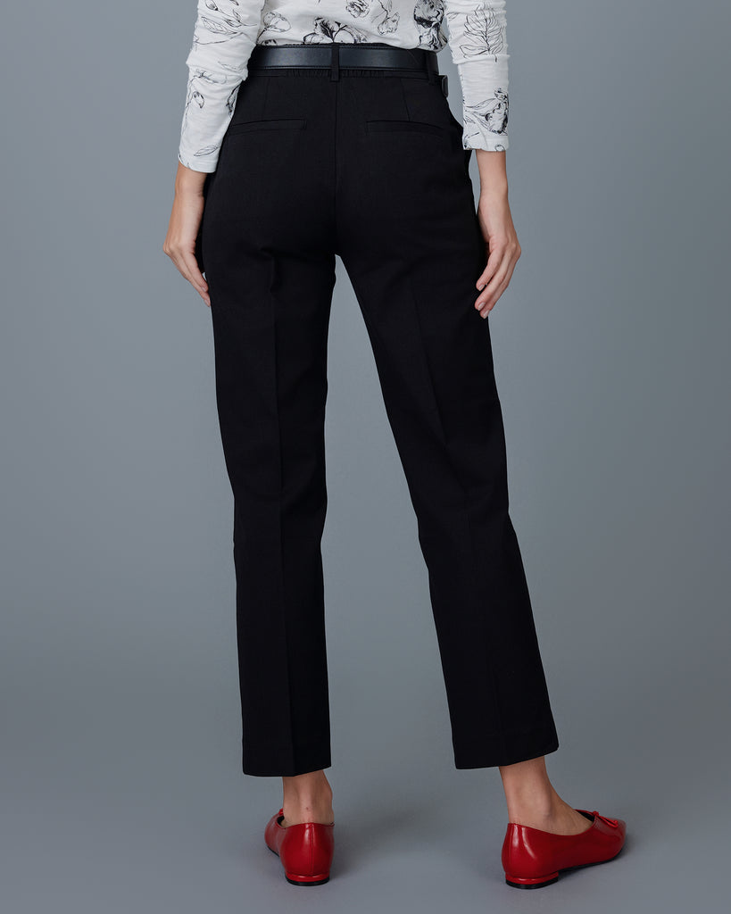 Woman wearing black tapered trousers