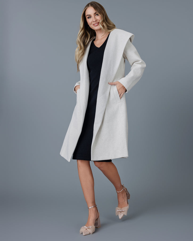 Woman in a tan long sleeve coat