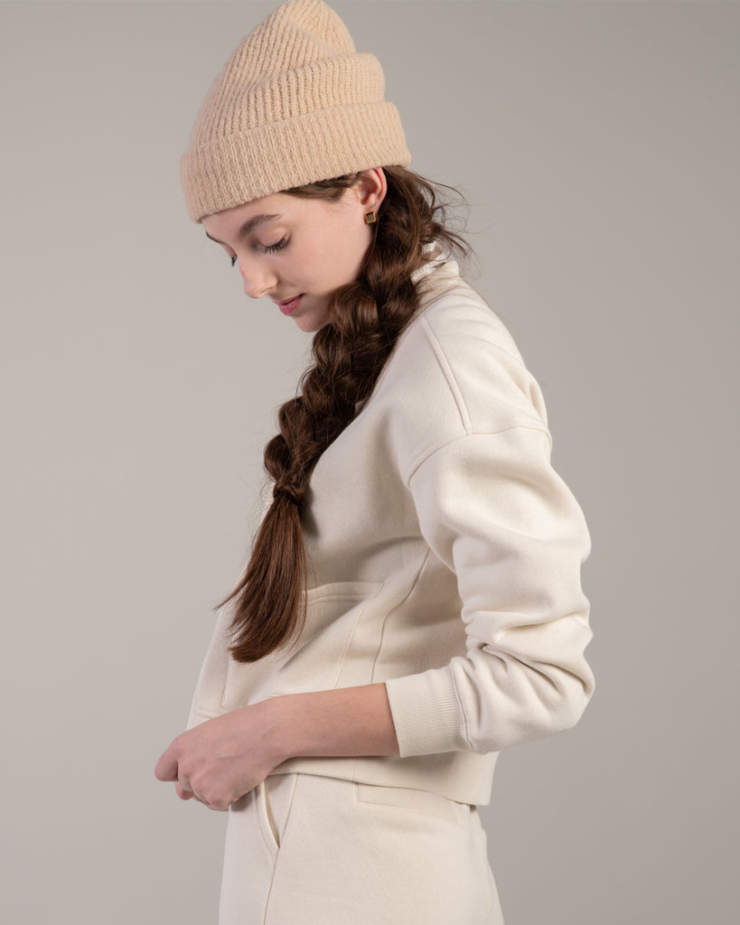 Woman in a white zip up sweatshirt