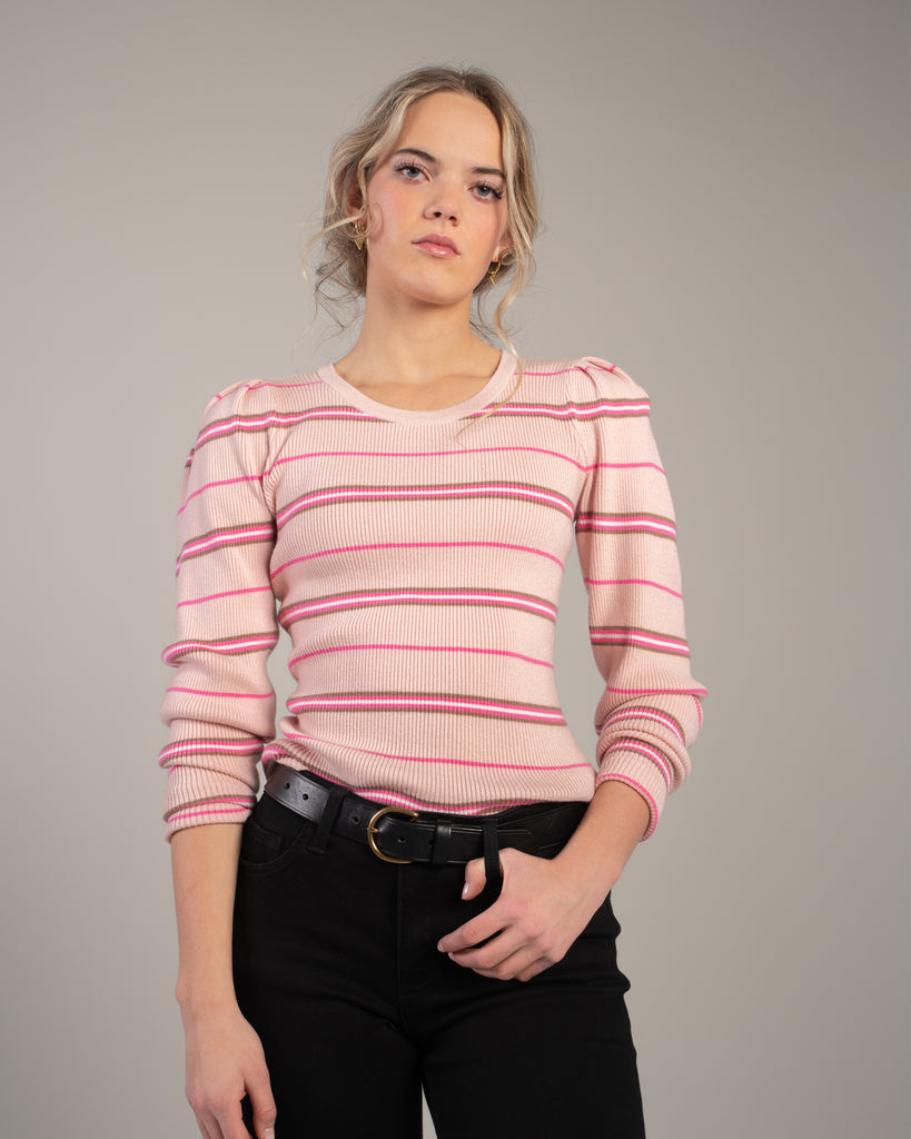 Woman in a pink striped long sleeve top