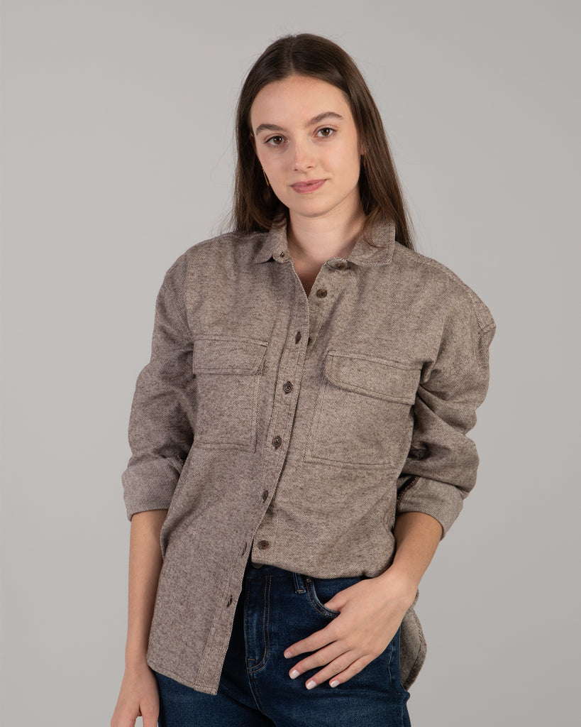 Woman in a brown long sleeve buttondown sweater