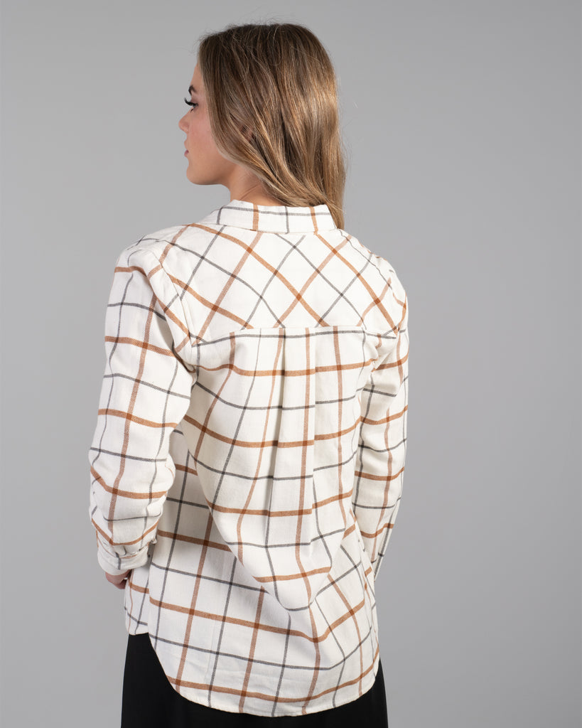 Woman in a beige plaid buttondown