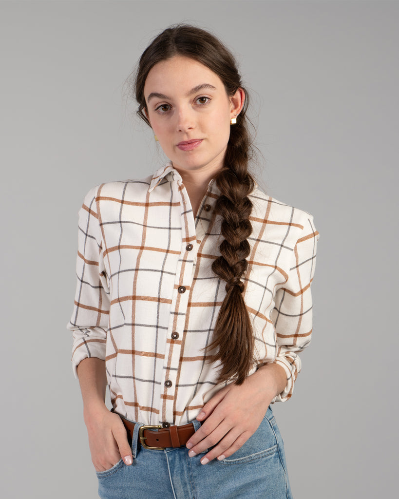 Woman in a beige plaid buttondown