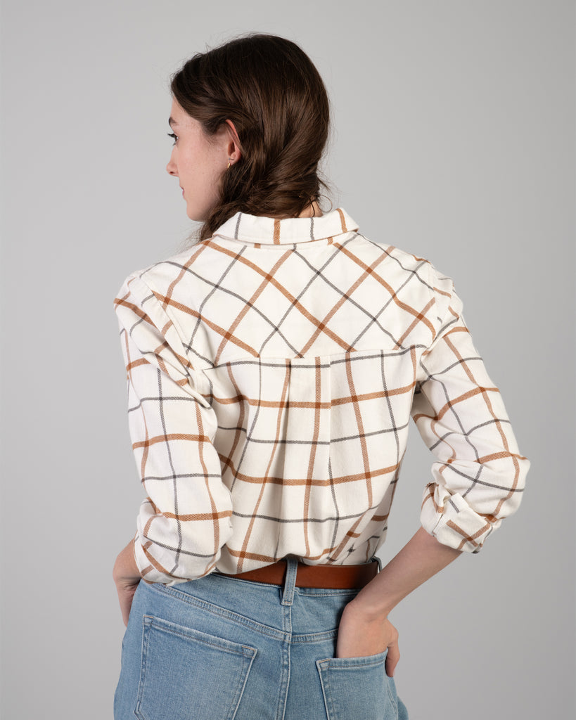 Woman in a beige plaid buttondown