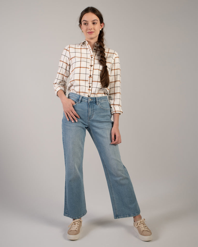 Woman in a beige plaid buttondown