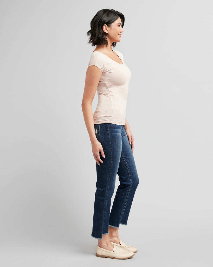 Woman in a short sleeve, fitted, basic tee