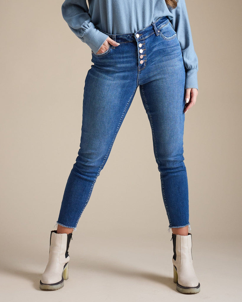 Woman in blue mid-rise skinny jeans