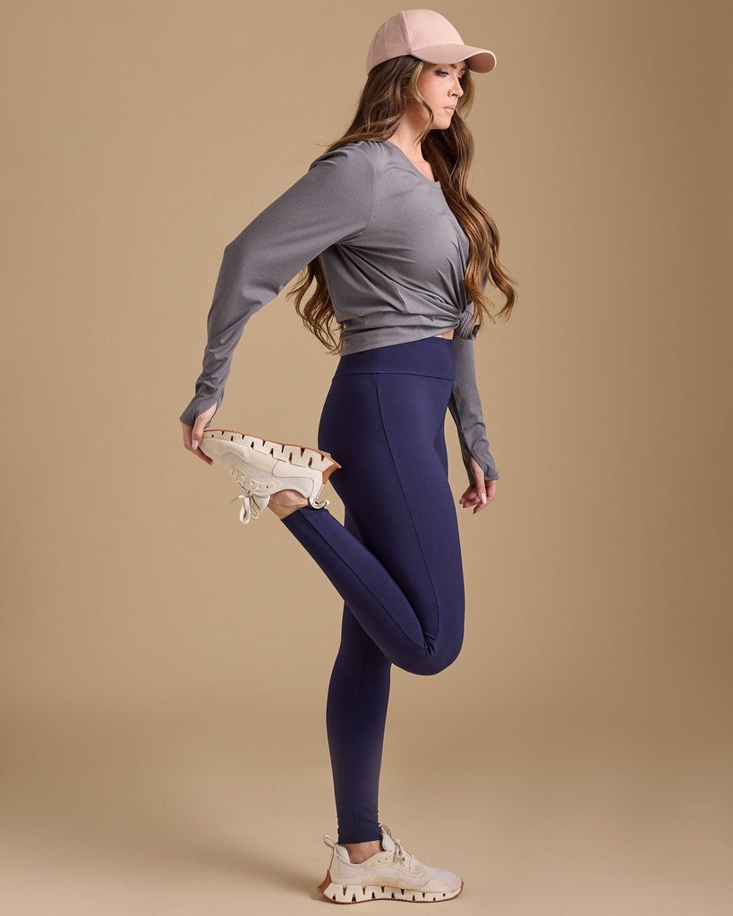 Woman in navy highwaisted leggings